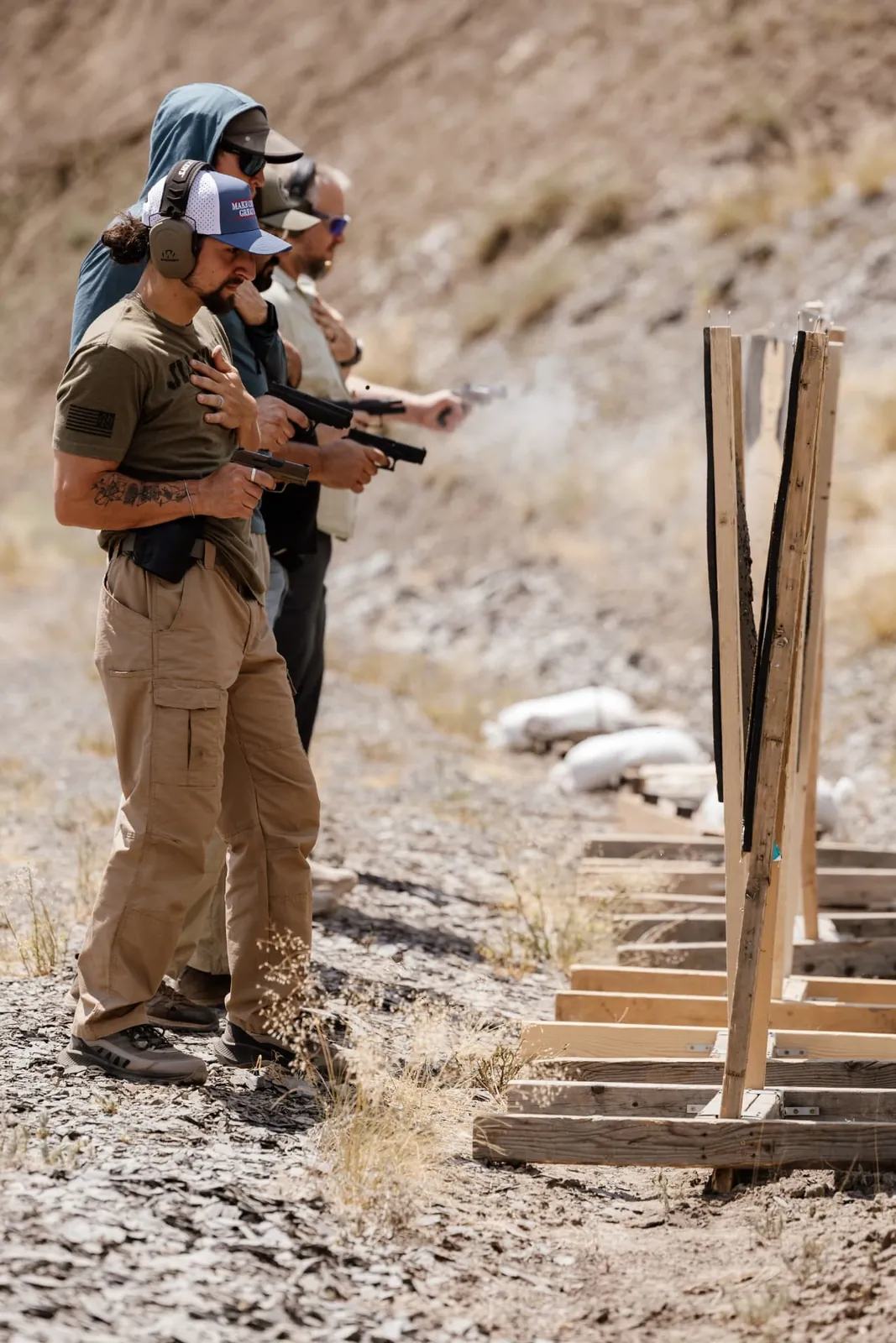 Students shooting a bay of steel and cardboard targets